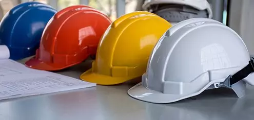row of hardhats for contractors