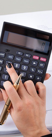 close up view of bookkeeping using calculator